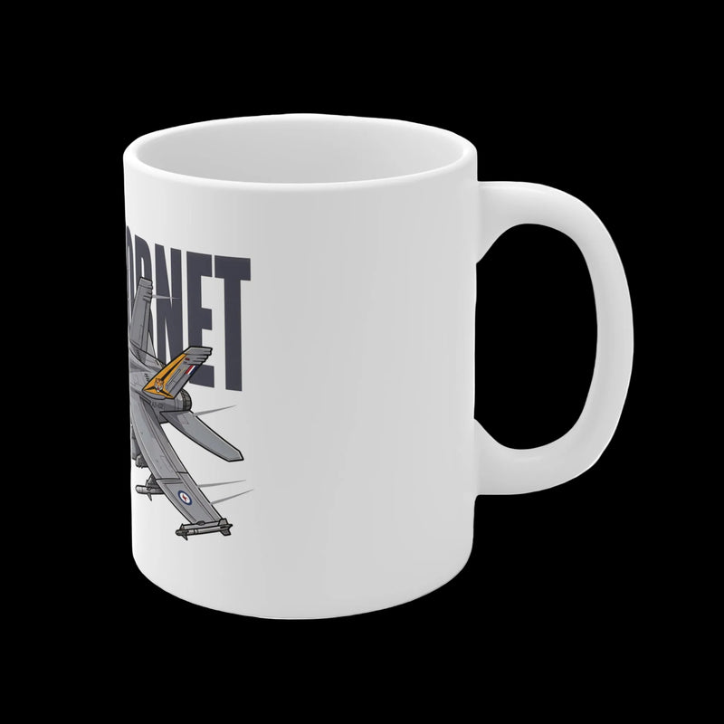 A white ceramic mug featuring a graphic illustration of a gray fighter jet with a yellow tail detail and the word 'JARNET' printed in dark gray, shown on a clean white background.