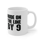 White mug with black text 'NUDE ON THE LINE BY 9' on a white background