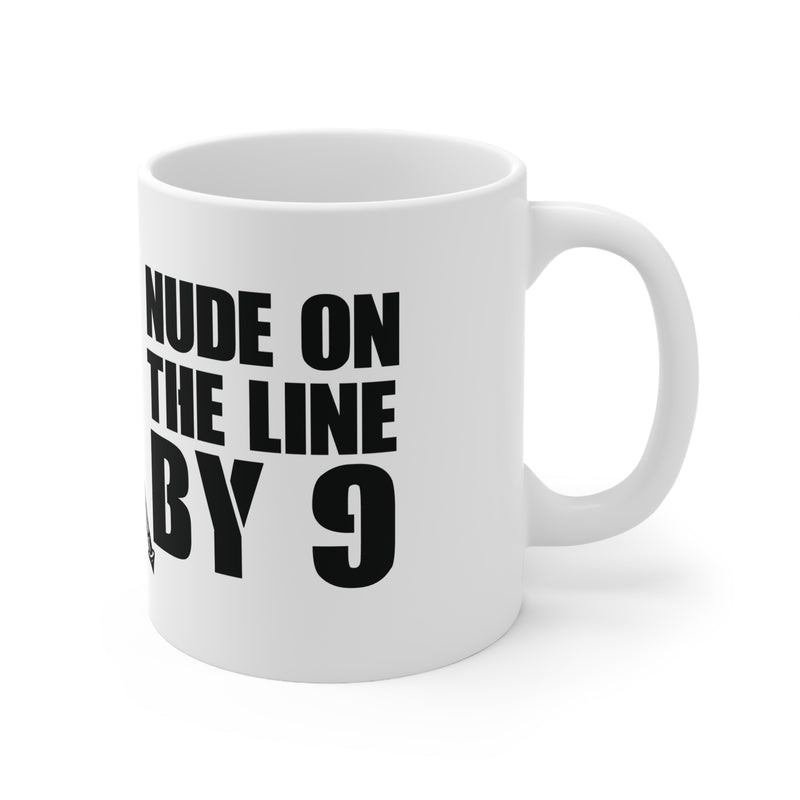 White mug with black text 'NUDE ON THE LINE BY 9' on a white background