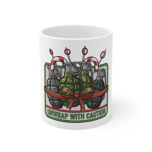 White mug with a graphic design of grenades and a bow, and text 'Unwrap with Caution' on a white background.