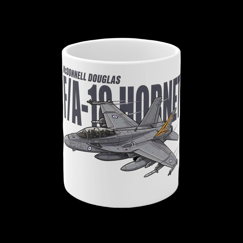 A white ceramic mug featuring a printed graphic of a McDonnell Douglas F/A-18 Hornet fighter jet in gray with a small orange accent, alongside the text 'McDonnell Douglas' and 'F/A-18 HORNET'.