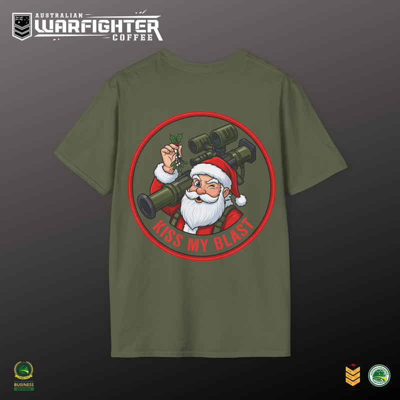 Green t-shirt with Santa Claus holding a cannon and 'Kiss My Blast' text on a dark background, featuring the Australian Warfighter Coffee brand.