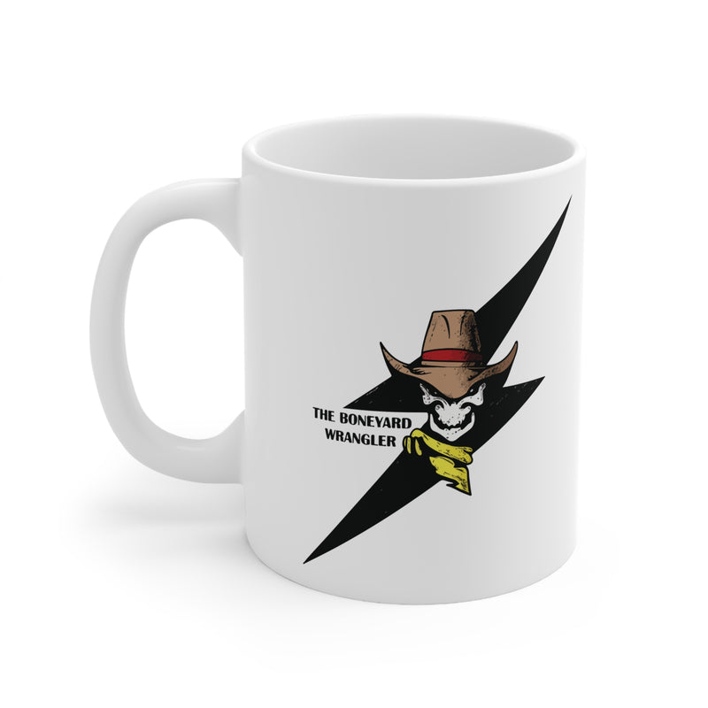 White mug with a graphic design featuring a cowboy hat and skull, labeled 'The Boneyard Wrangler', on a white background.