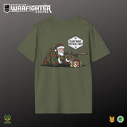 Green t-shirt with a graphic of Santa Claus holding a rifle and presents, on a dark background.