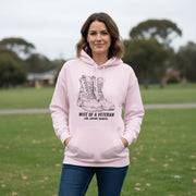 Australian Warfighters Coffee pale pink cotton-poly blend hoodie with graphic of combat boots and text "Wife of a Veteran — Love. Support. Sacrifice."
